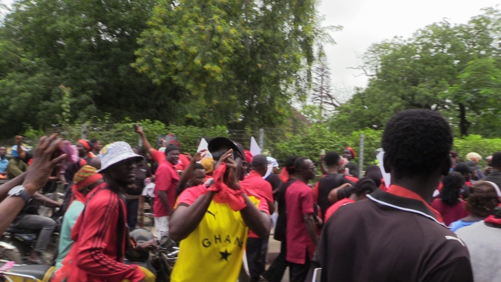 NPP supporters marching at the Democracy Under Attack protest in Accra, August 2026